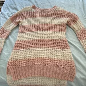 Pink and white long sleeved shirt. It is netted so I would wear a shirt under.